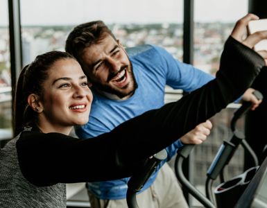 Couple Taking Selfie In Gym
